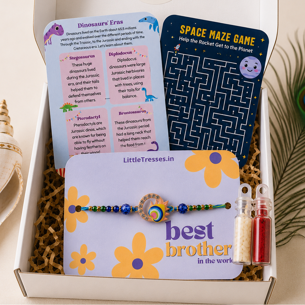 Celebrate Raksha Bandhan with the Little Tresses Designer Mor Pankh Rakhi Gift Box. Includes a premium peacock feather Rakhi, activity cards, greeting card, roli bottle and rice bottle in an elegant gift-ready box.