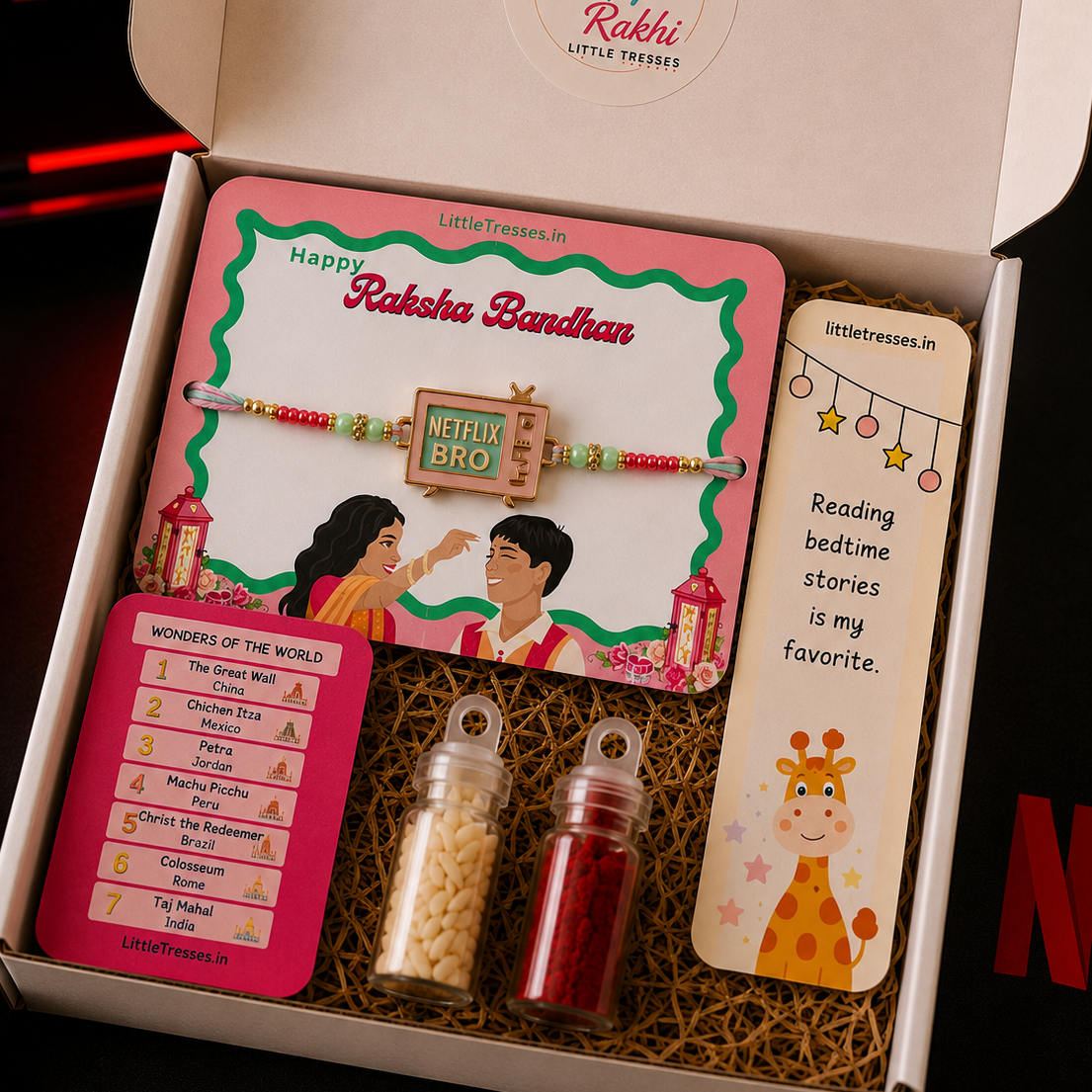 Celebrate Raksha Bandhan with the Little Tresses Netflix Bro Rakhi Gift Box. Includes a Netflix-inspired Rakhi, educational activity cards, greeting card, roli bottle and rice bottle in a premium ready-to-gift box.