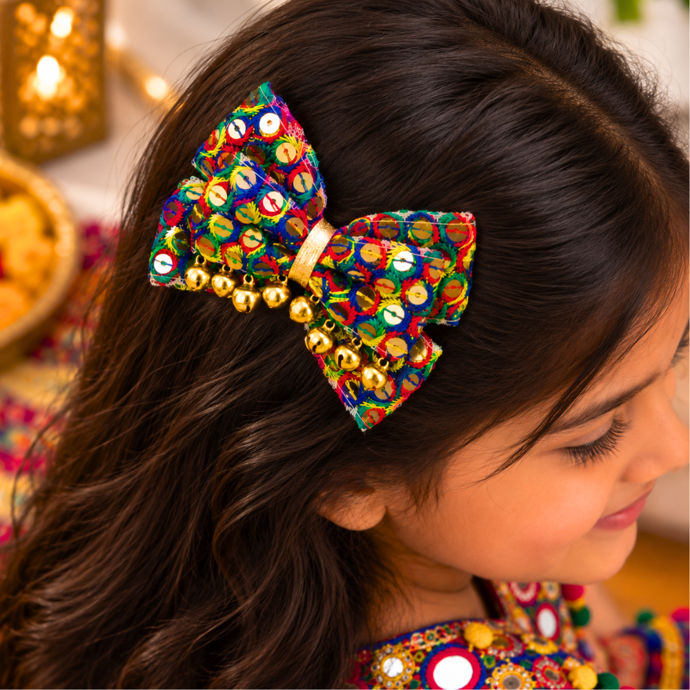 Sitaara Navratri bow with sequin detailing and golden ghunghroo alligator clip for girls