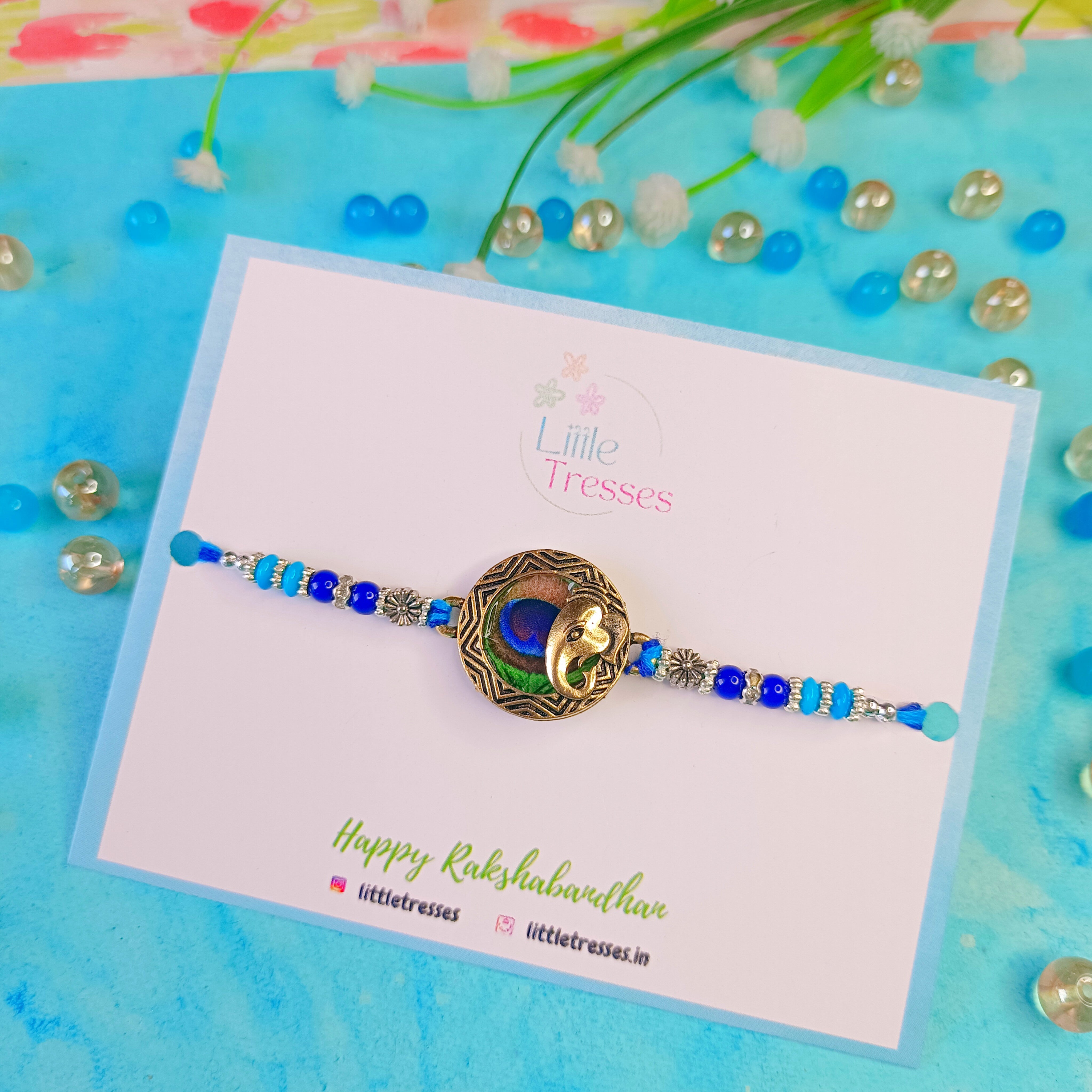 Ganesha with Peacock Feather Rakhi