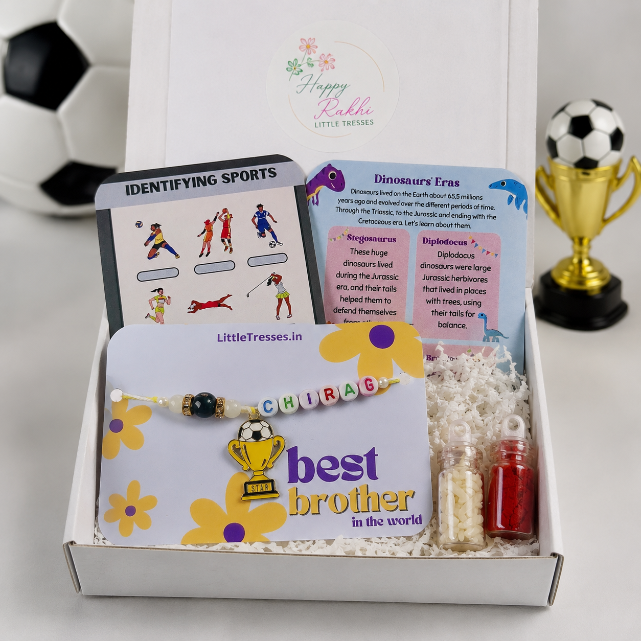 Make Raksha Bandhan extra special with the Little Tresses Personalized Football Enthusiast Bro Rakhi Gift Box. Includes a custom name football Rakhi, activity cards, greeting card, roli bottle and rice bottle in a premium gift-ready box.