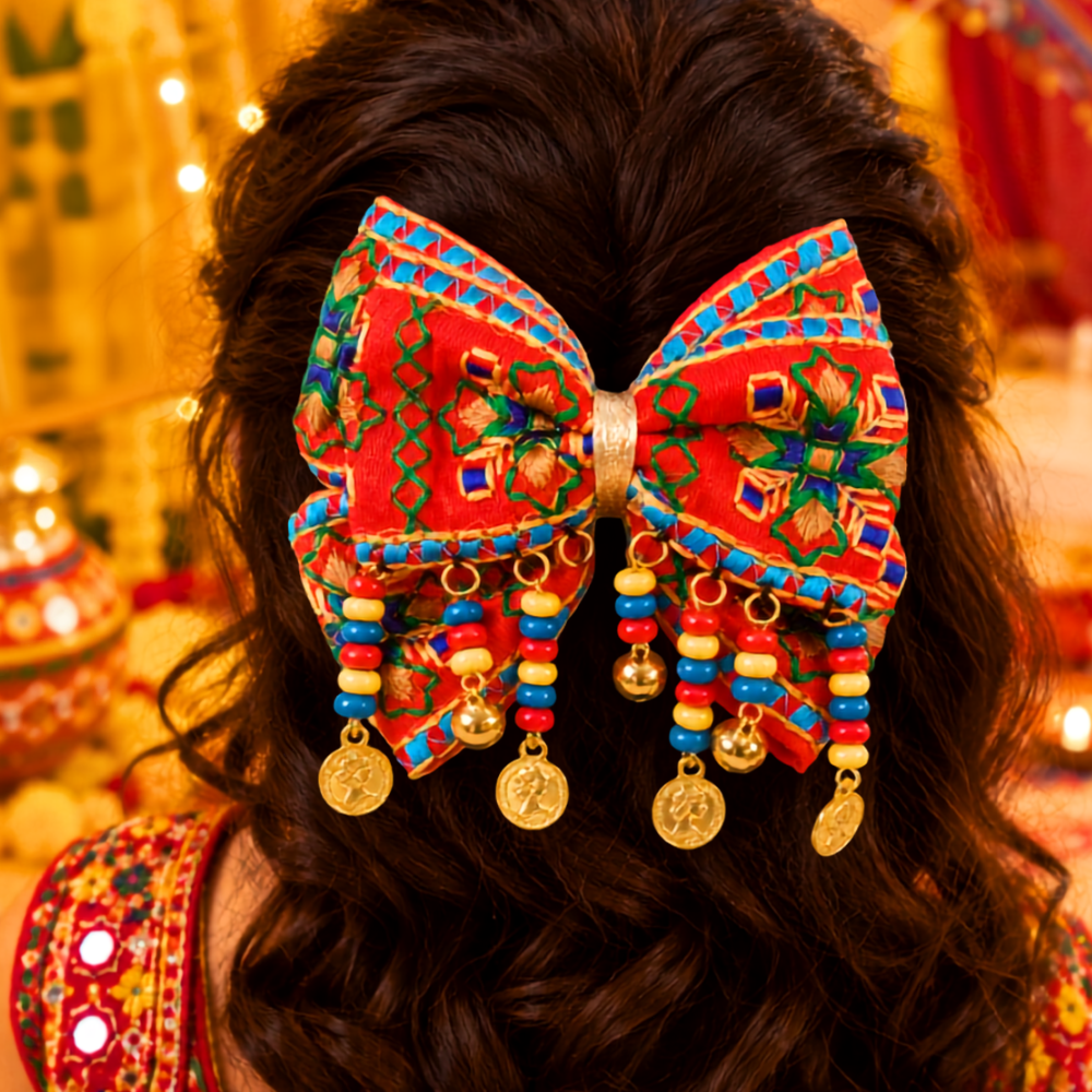 Navratri beaded bow with ghunghroo and sikka alligator clip for girls in red and yellow