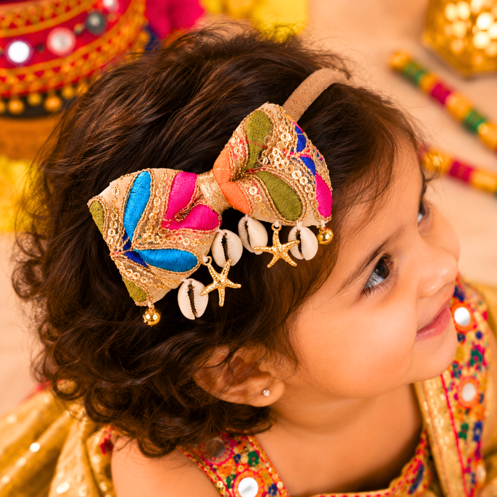 Golden soft Navratri headband with Kaudi shells, stars and ghungroo for babies