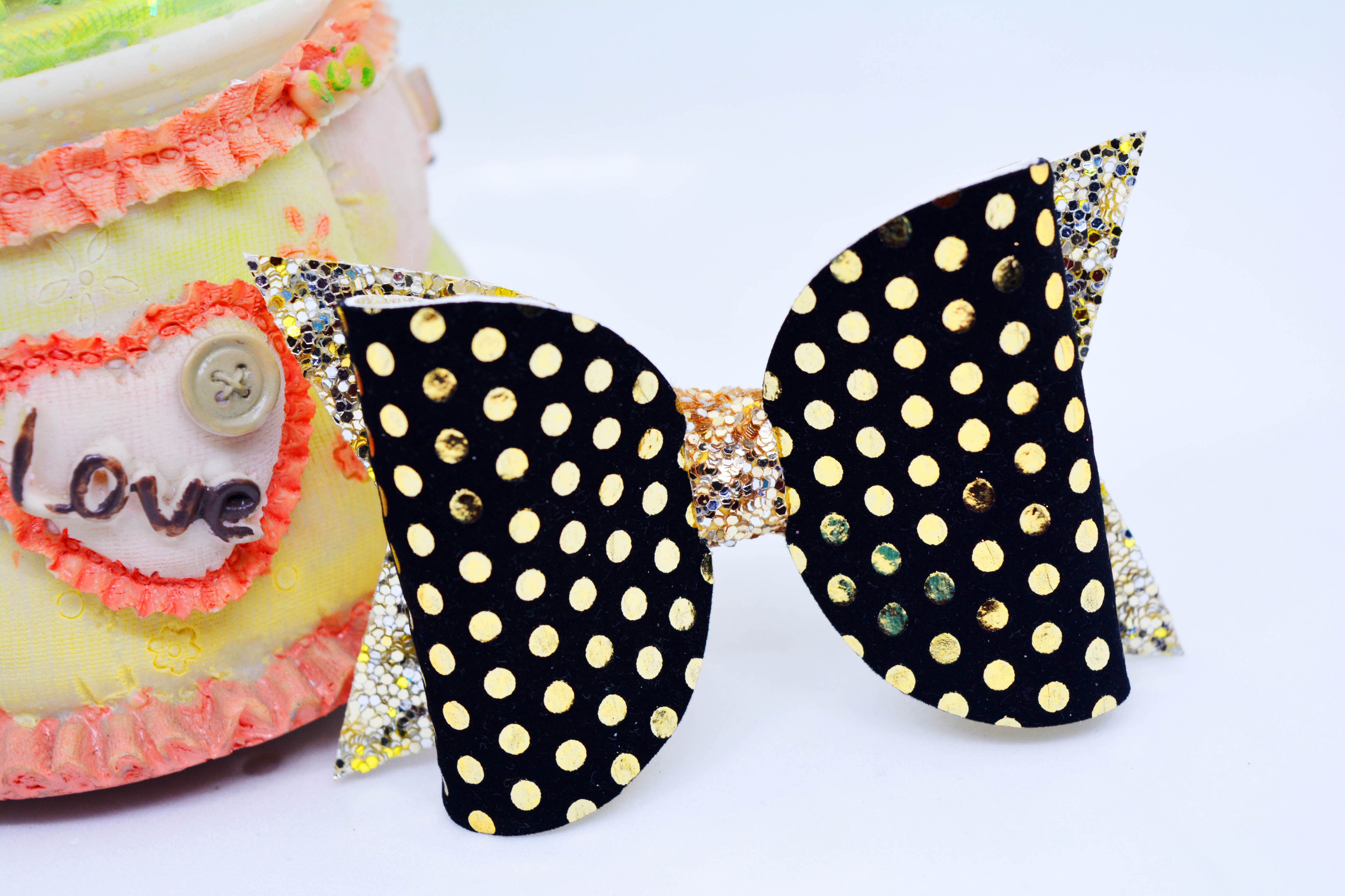 Bow with Arrow Clip - Black & Golden Polka